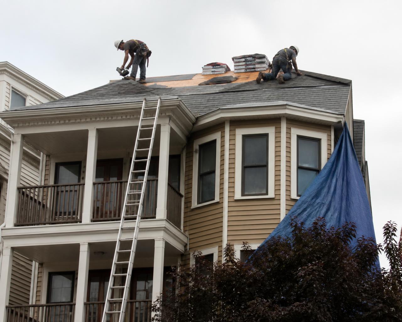 Always On Top Roofing crew working on a home in Dorchester, MA