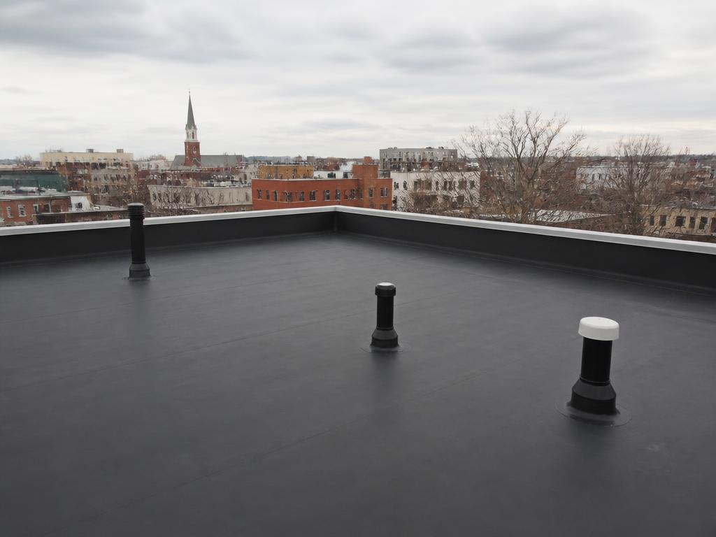 Roofing project near Milton, MA — Flat rubber roof system — South Boston, MA