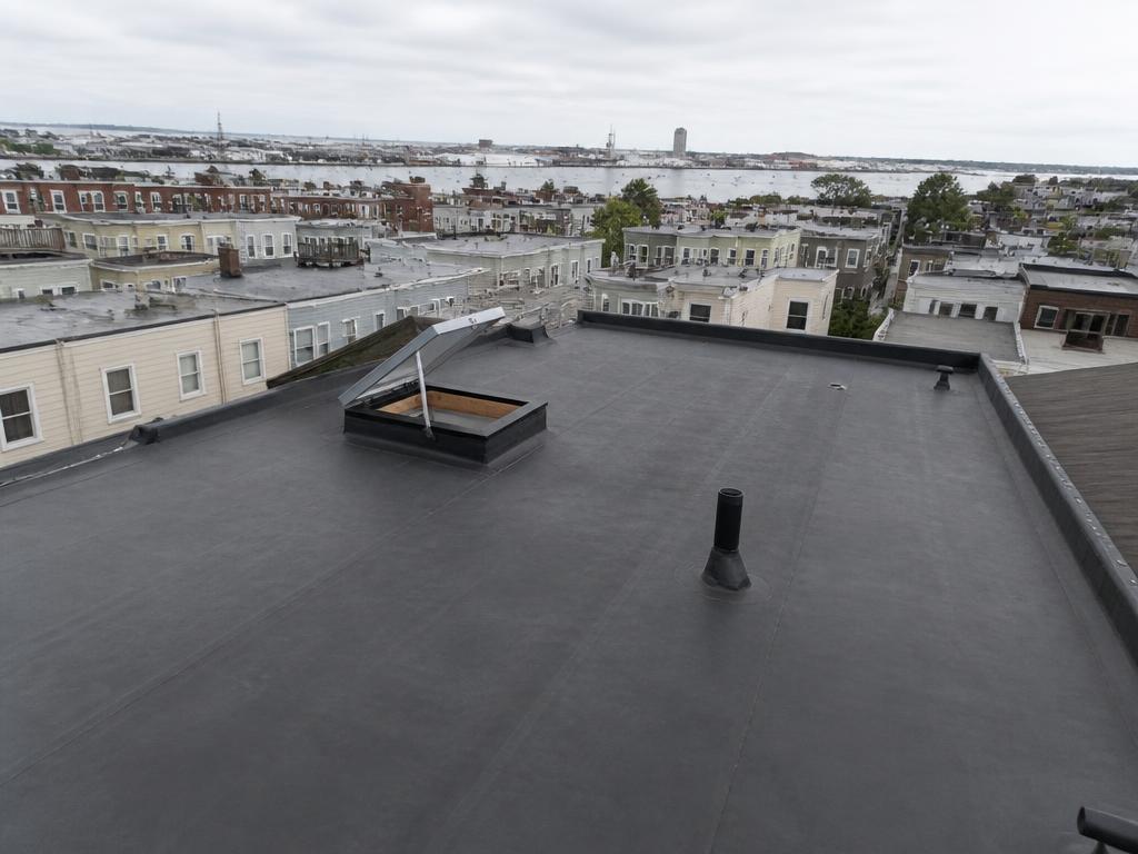 Roofing project near South Boston, MA — Flat rubber roof replacement — South Boston, MA